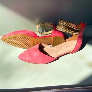 Pink flat with gold ankle straps